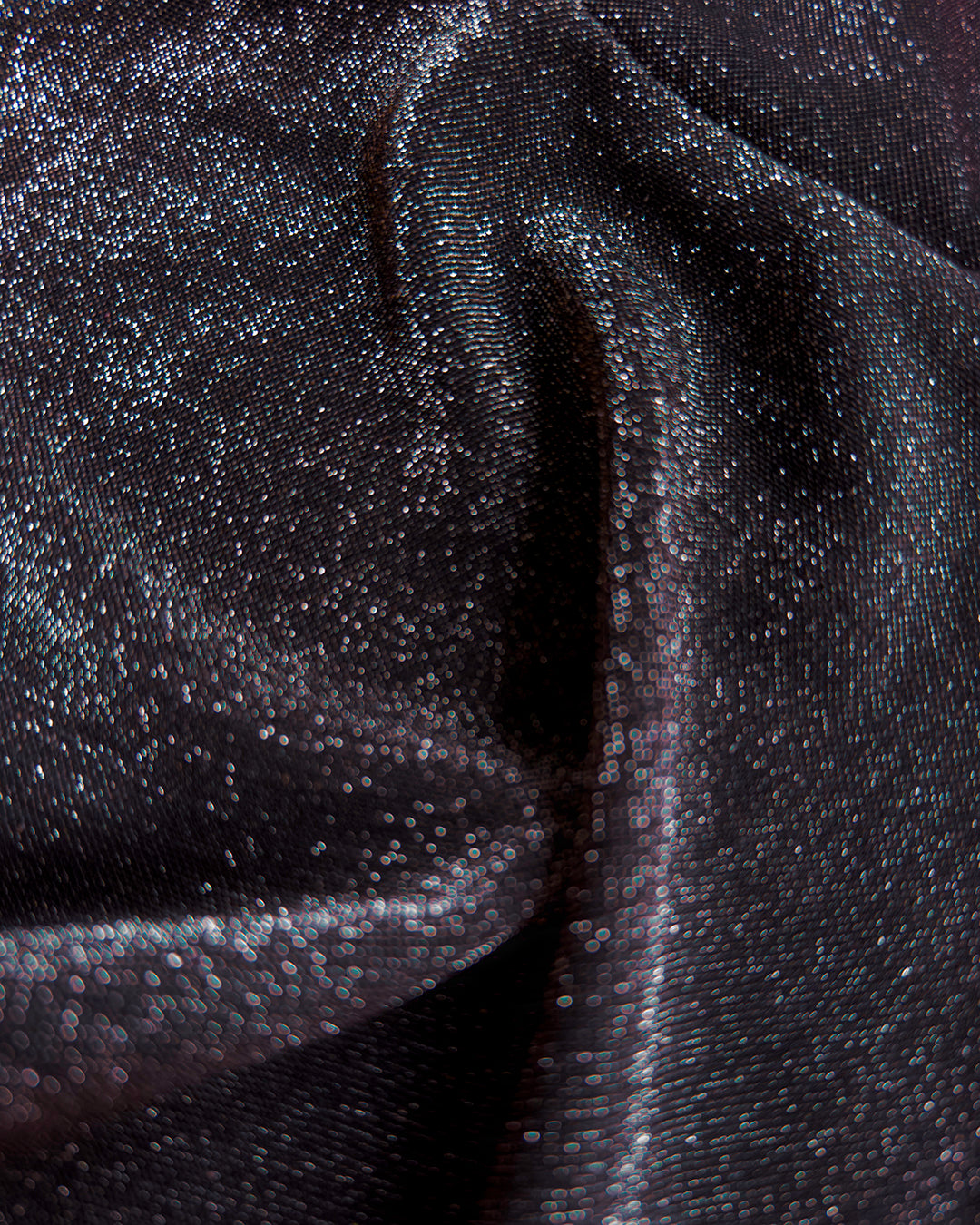 Soft, polyester knit metallic removable collar. Shimmer is fallout-free, and color shifts between black, silver, purple, blue, and green.
