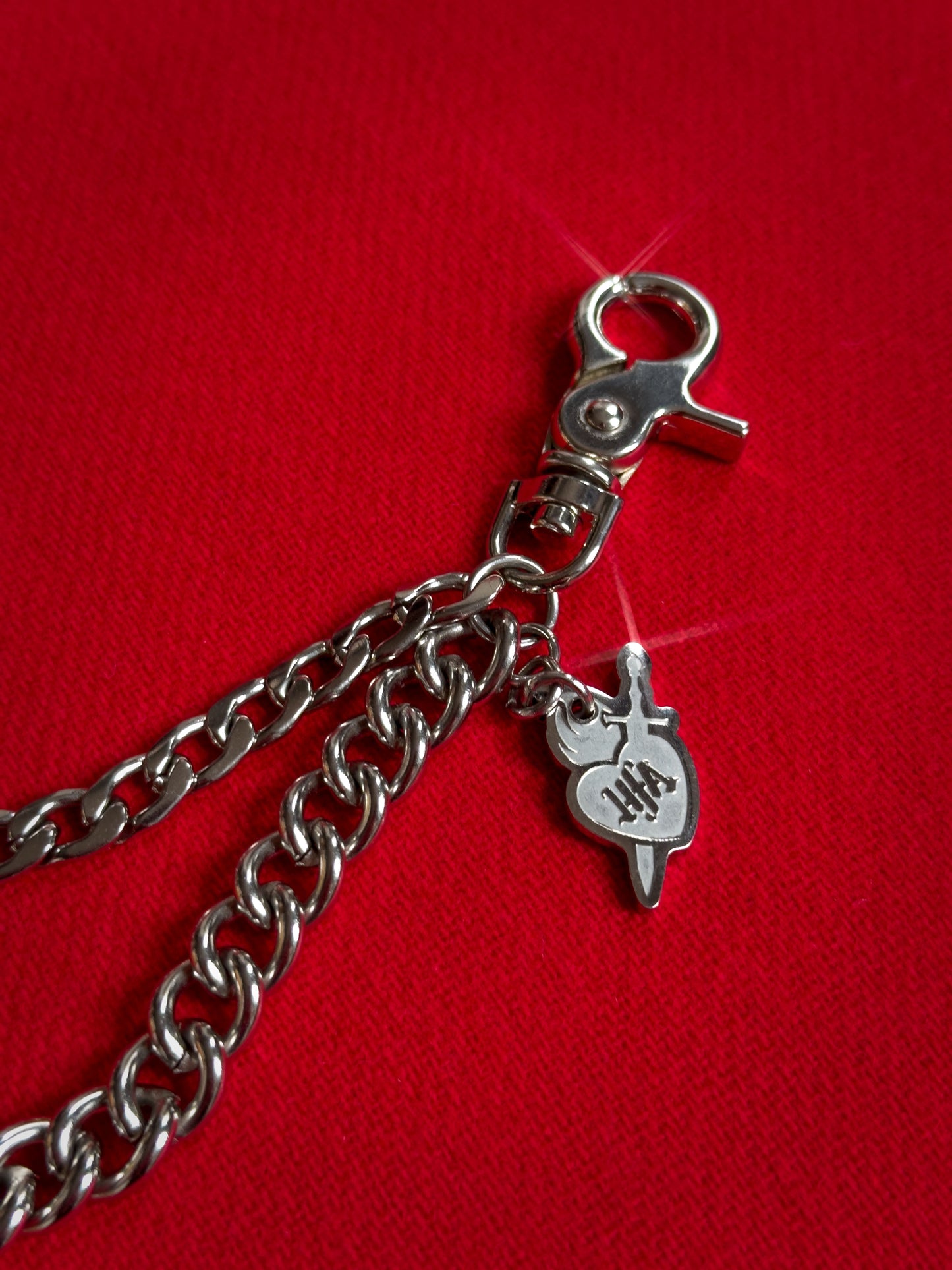 Double layer stainless steel silver pocket chain with lobster clasps, an 8 inch extender chain, and custom laser-cut HFA sacred heart charm.