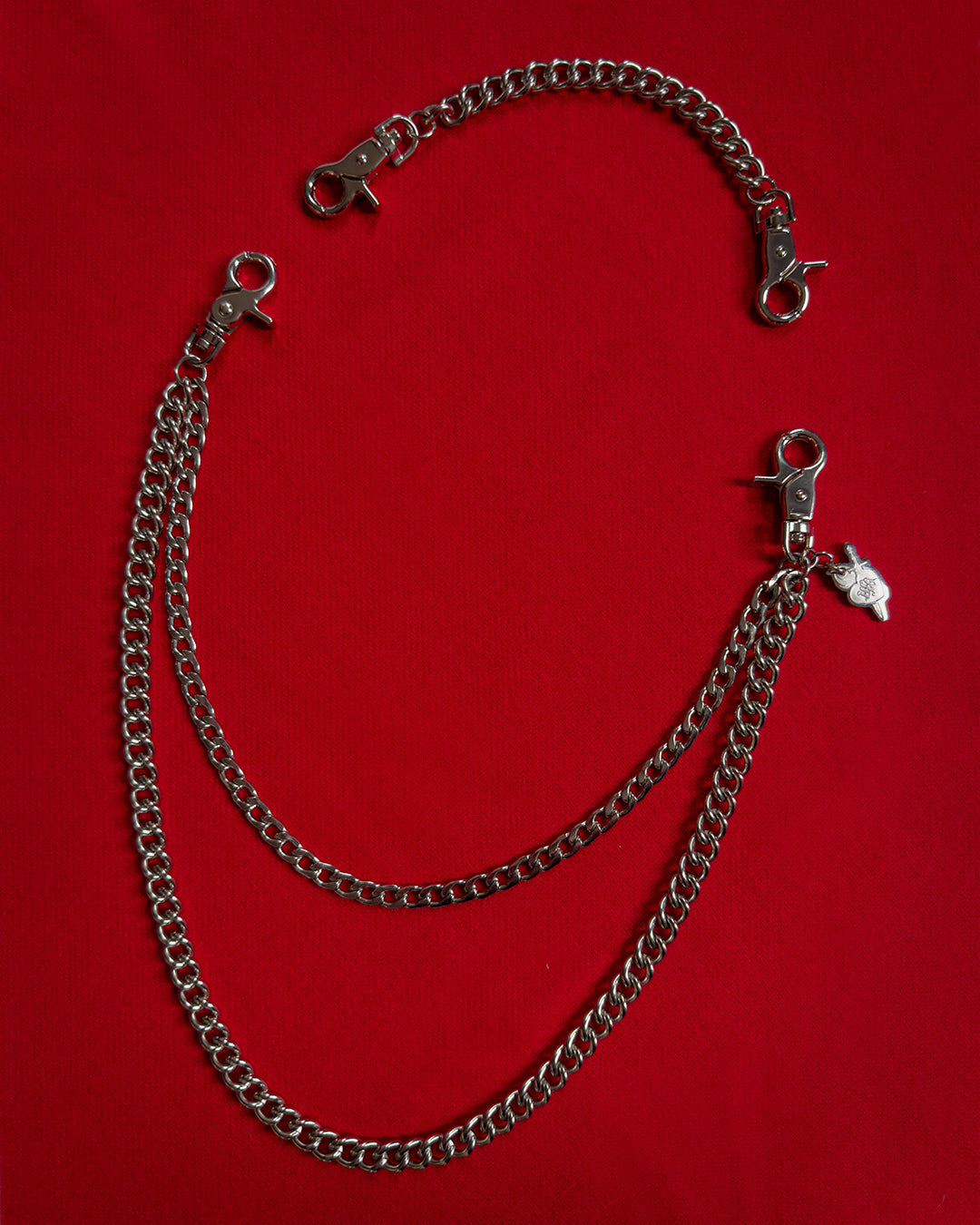 Double layer stainless steel silver pocket chain with lobster clasps, an 8 inch extender chain, and custom laser-cut HFA sacred heart charm.