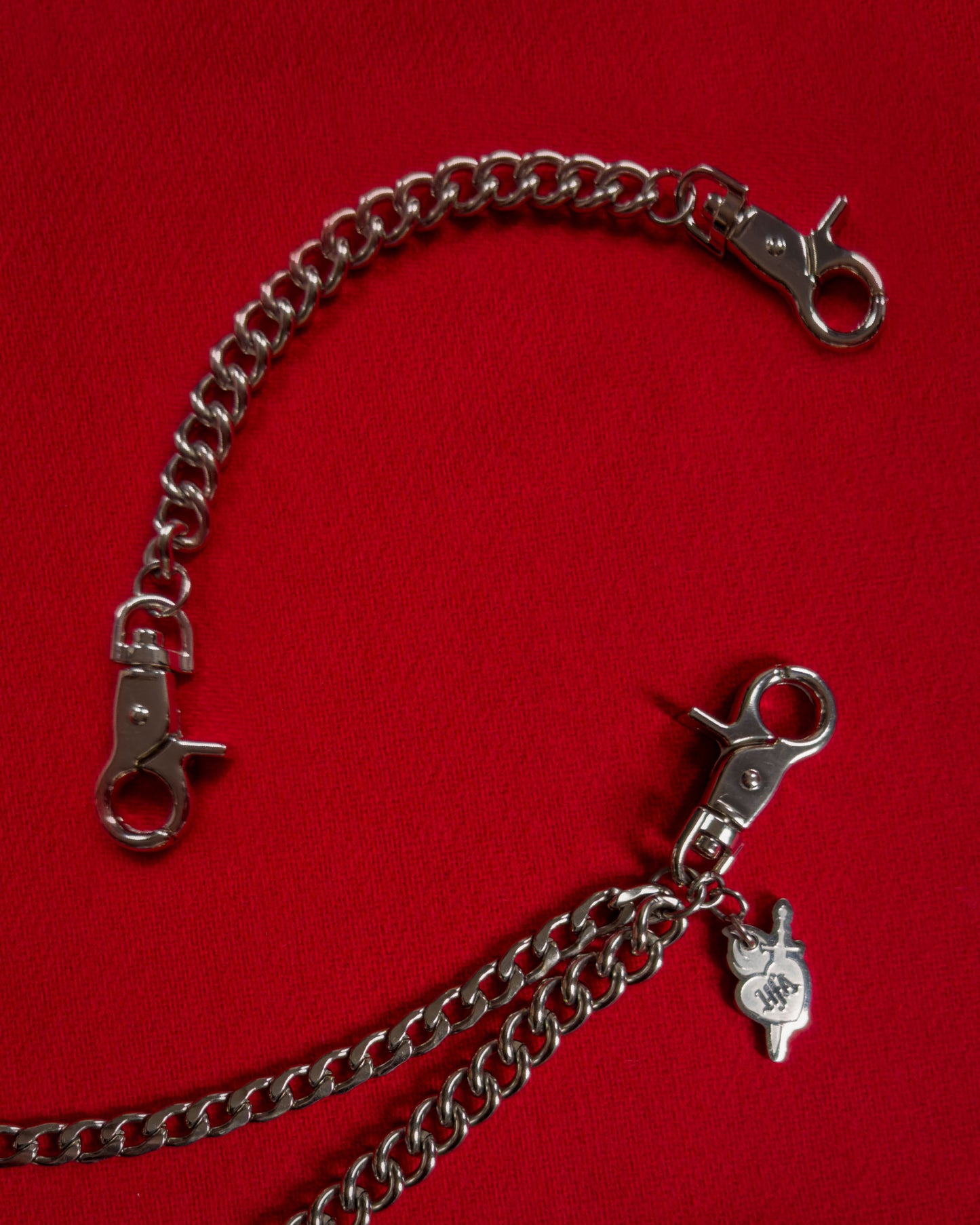 Double layer stainless steel silver pocket chain with lobster clasps, an 8 inch extender chain, and custom laser-cut HFA sacred heart charm.
