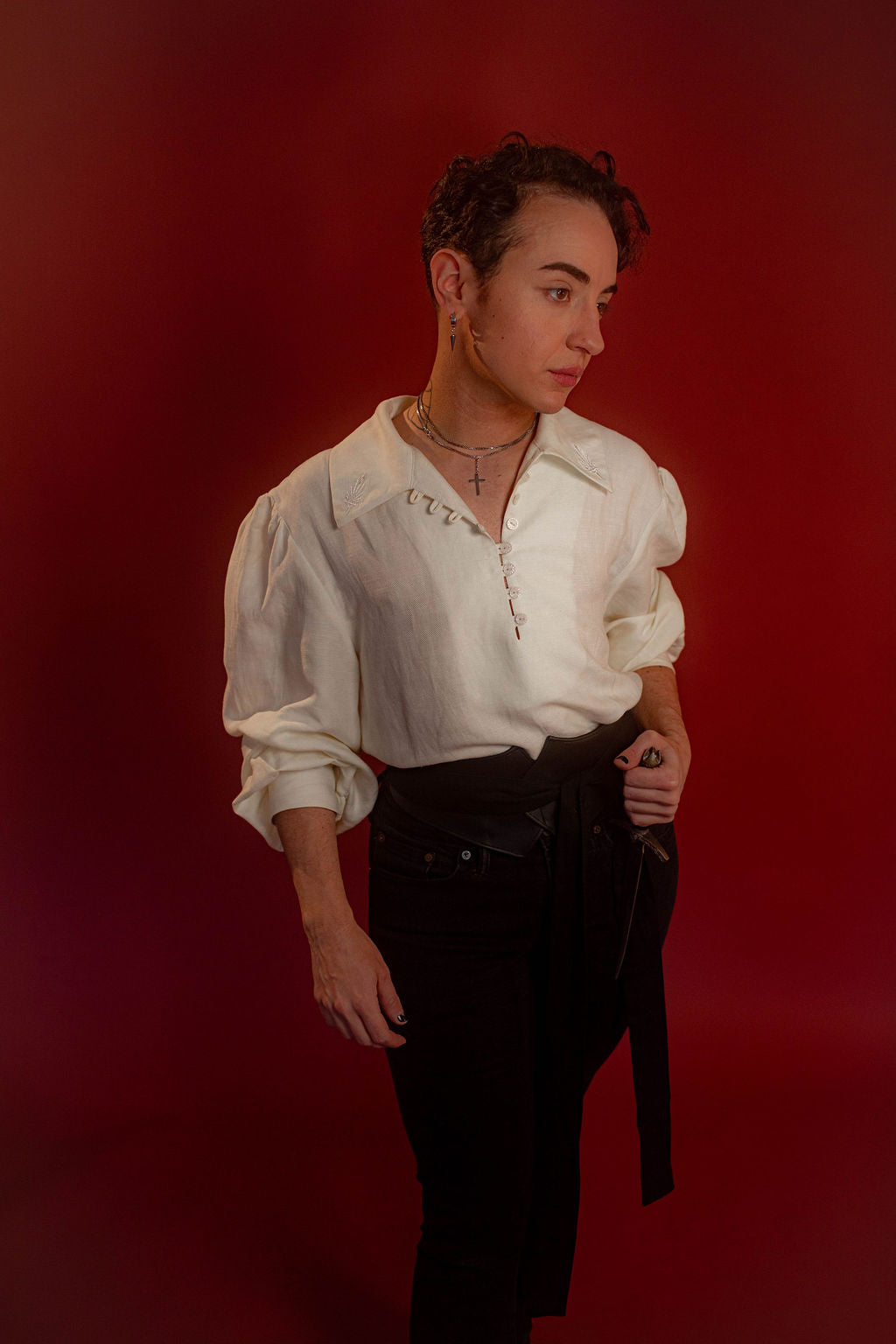 Soft, off-white tencel and linen blend to make the soft, flowy, draped shape of our poet shirt. Tone-on-tone embroidery on the collars, cuffs, and back yoke and buttons down the front and cuffs.