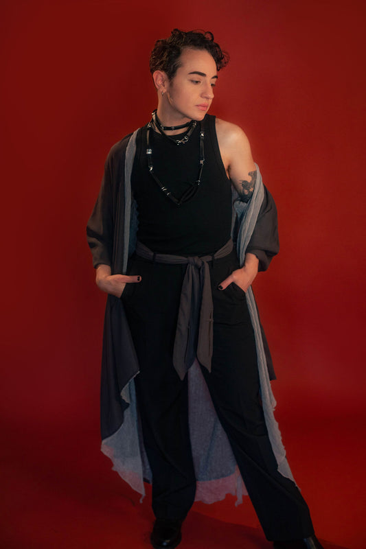 Soft, polyester grey and silver chiffon layered into a sheer, knee-length robe wrap dress. Features a tone-on-tone embroidered sword down the back, and two embroidered on a matching detachable waist tie.