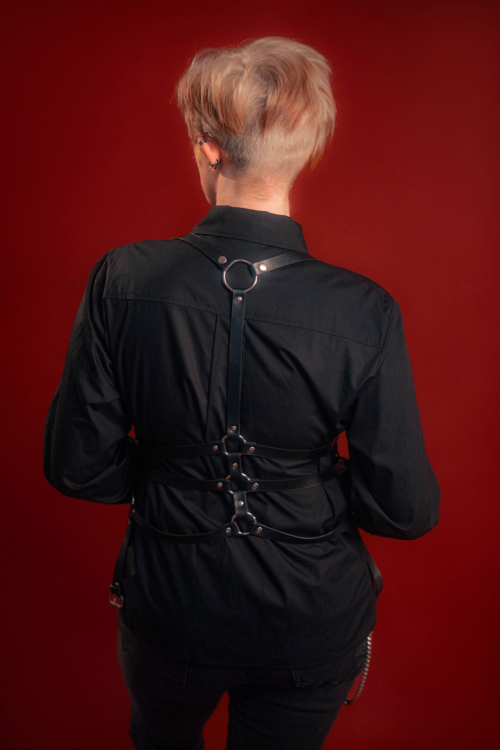 black cotton twill button up with a large black sword embroidered down the placket, and smaller swords embroidered on the collar points and cuffs.
