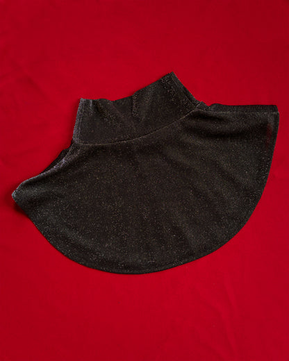 Soft, polyester knit metallic removable collar. Shimmer is fallout-free, and color shifts between black, silver, purple, blue, and green. 