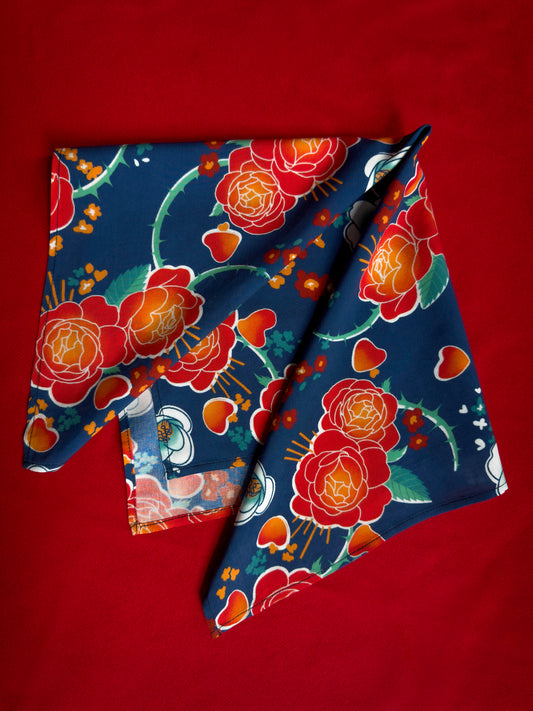Blue, red, orange, and teal floral patterned rayon bandana accessory with a silky feel. Matches both pattern and fabric as our Montague Button Down Hawaiian-style shirt.