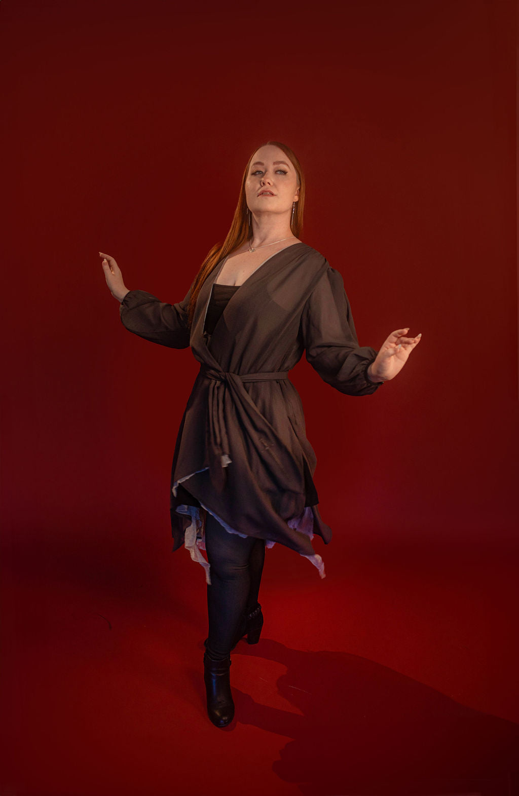 Soft, polyester grey and silver chiffon layered into a sheer, knee-length robe wrap dress. Features a tone-on-tone embroidered sword down the back, and two embroidered on a matching detachable waist tie.