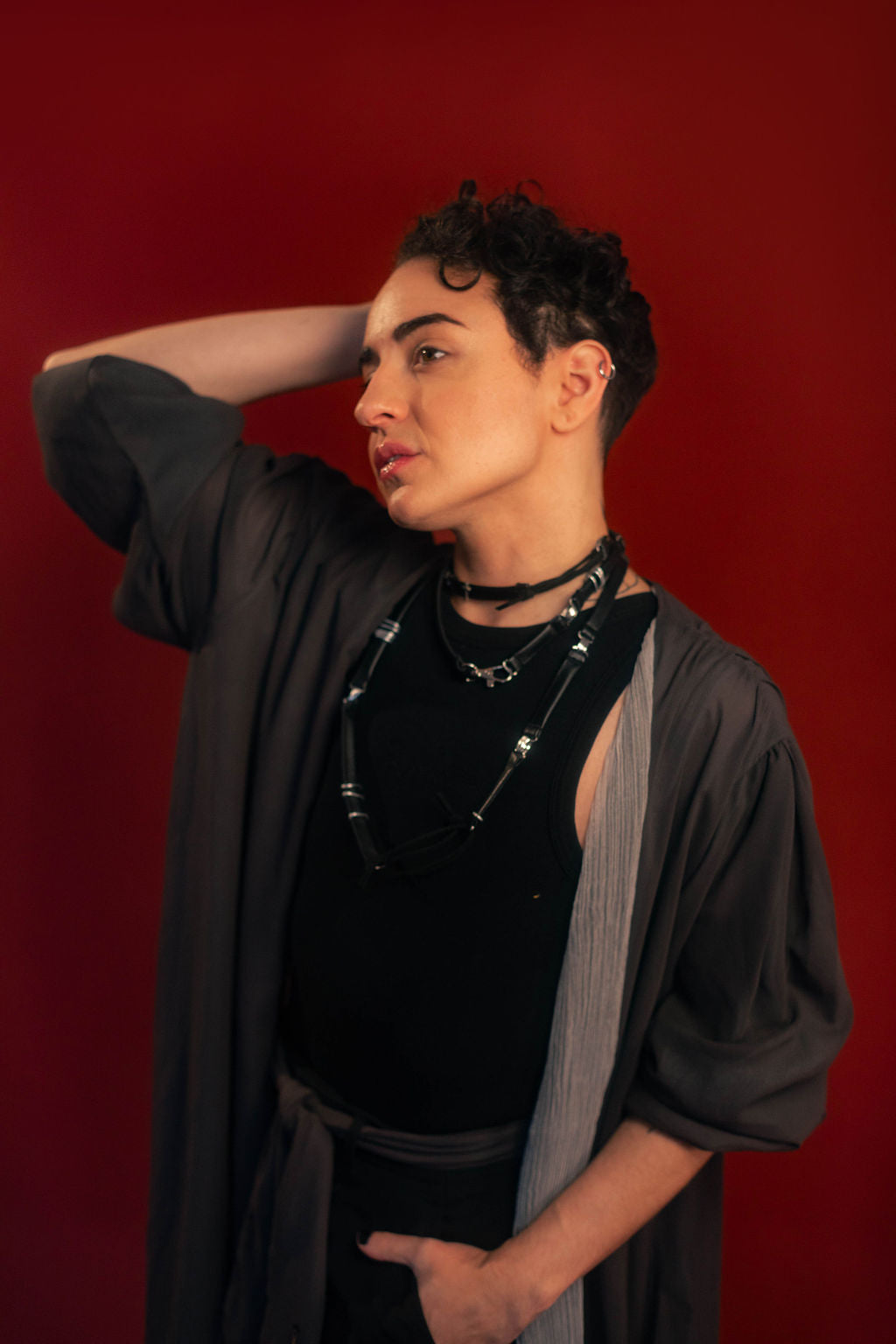 Soft, polyester grey and silver chiffon layered into a sheer, knee-length robe wrap dress. Features a tone-on-tone embroidered sword down the back, and two embroidered on a matching detachable waist tie.