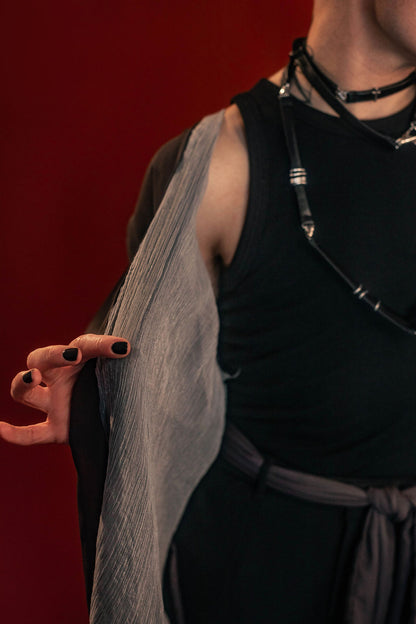 Soft, polyester grey and silver chiffon layered into a sheer, knee-length robe wrap dress. Features a tone-on-tone embroidered sword down the back, and two embroidered on a matching detachable waist tie.